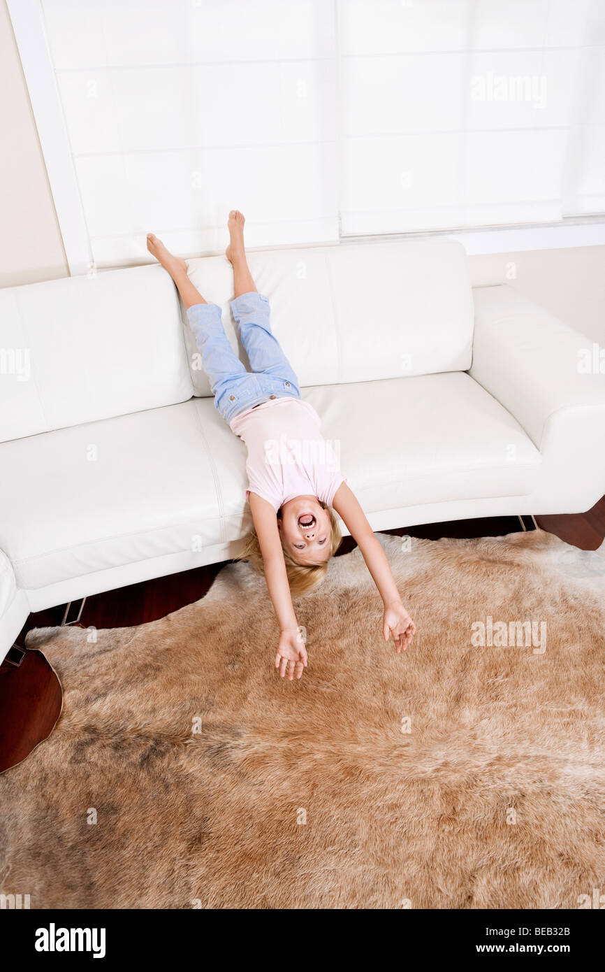 Barefoot girl lying on couch hi-res stock photography and images - Alamy