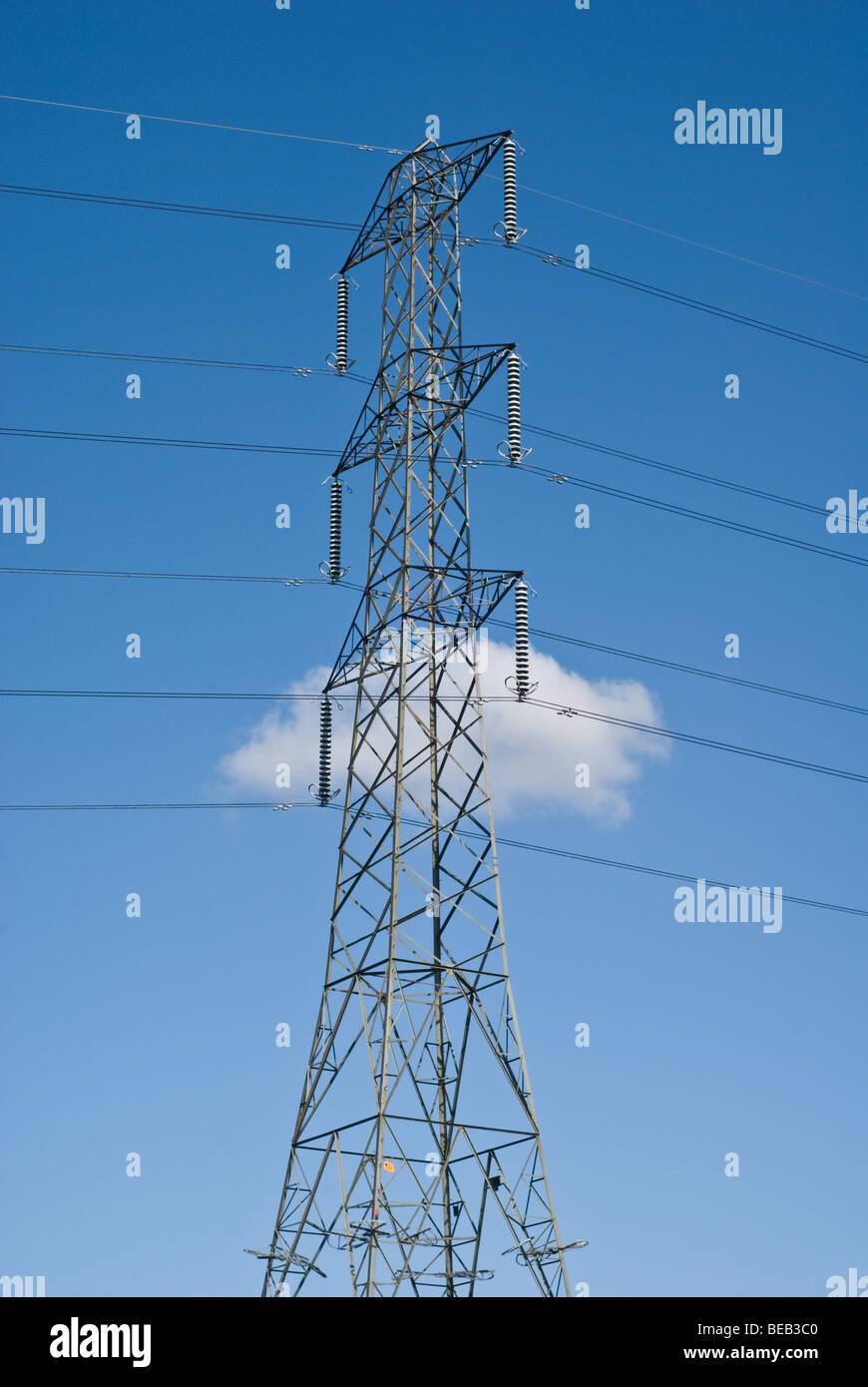 single electricity pylon against white cloud and blue sky Stock Photo ...