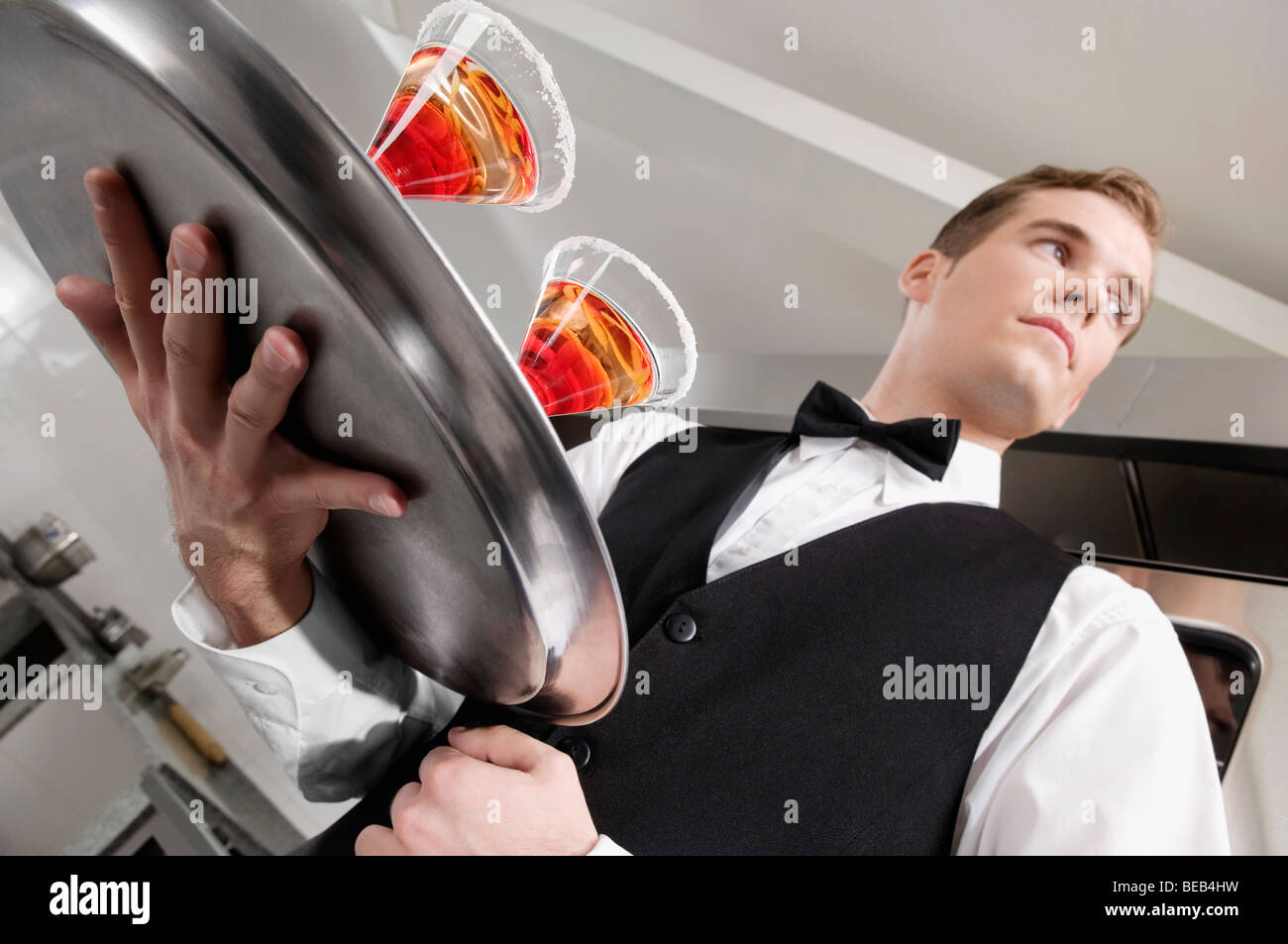 Waiter carrying food tray hi-res stock photography and images - Alamy