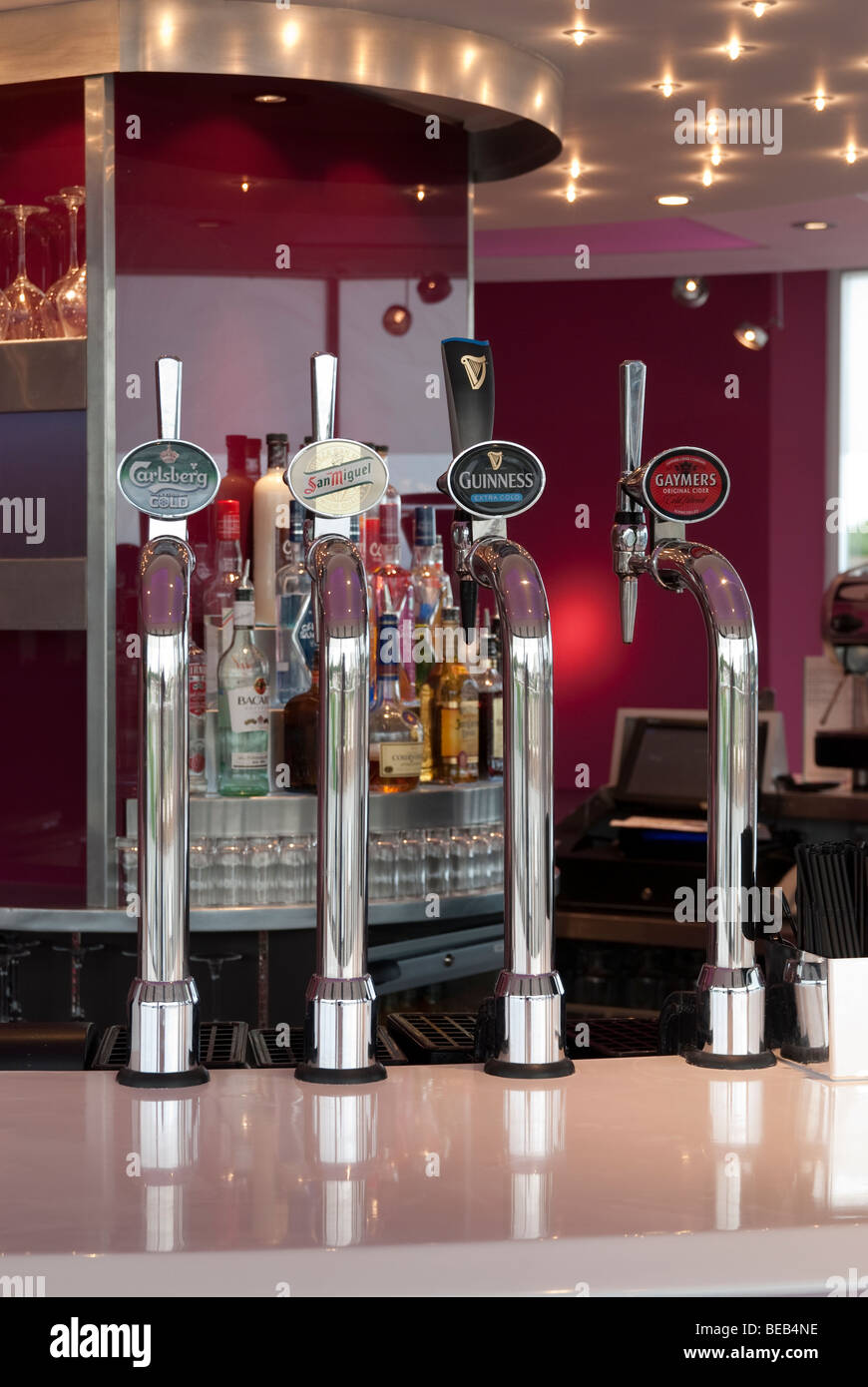 Beer taps on colourful bar at Ocean Hotel, Butlins, Bognor Regis Stock ...