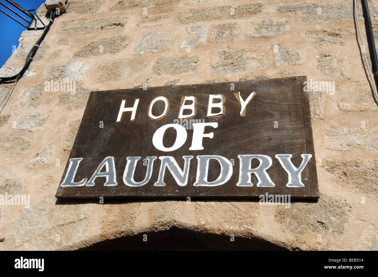 Sign hanging outside a laundry in the old city in Rhodos, Rhodes, Greece Stock Photo