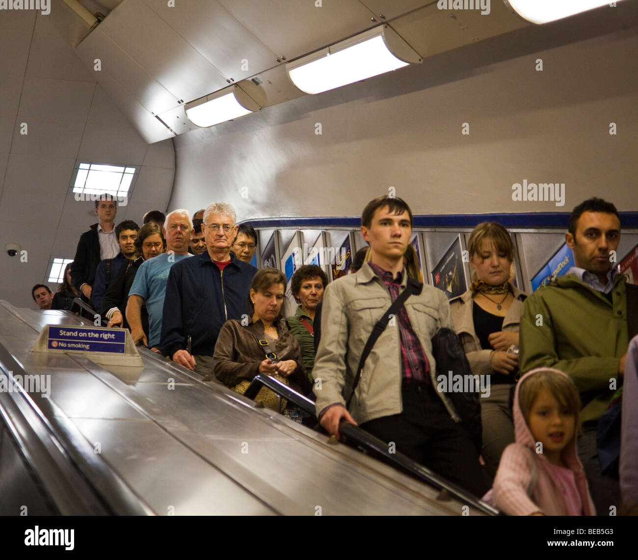commuters on escalator, London Underground, London, England, UK Stock Photo