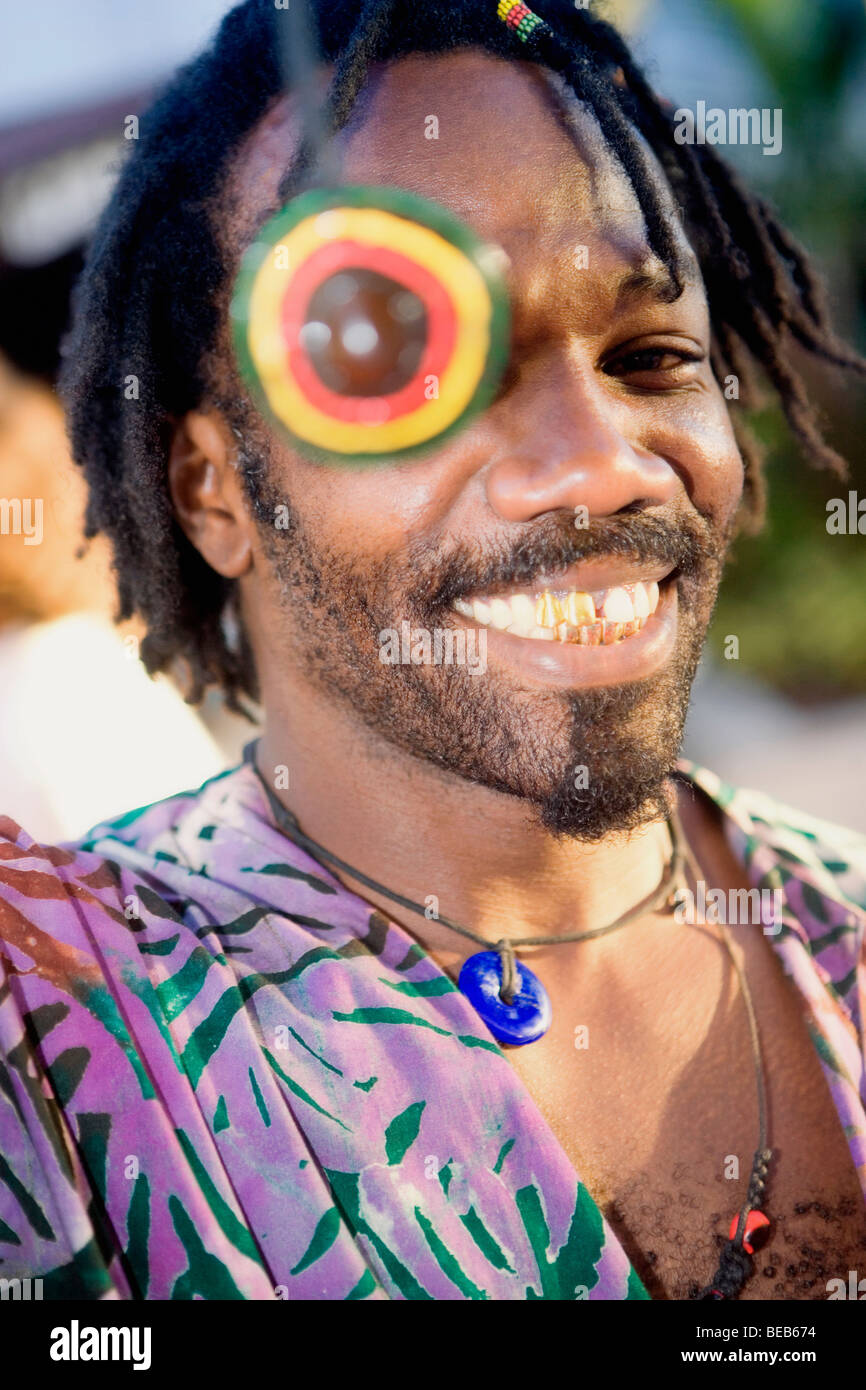 Portrait of a young man smiling with a necklace over his eye Stock ...