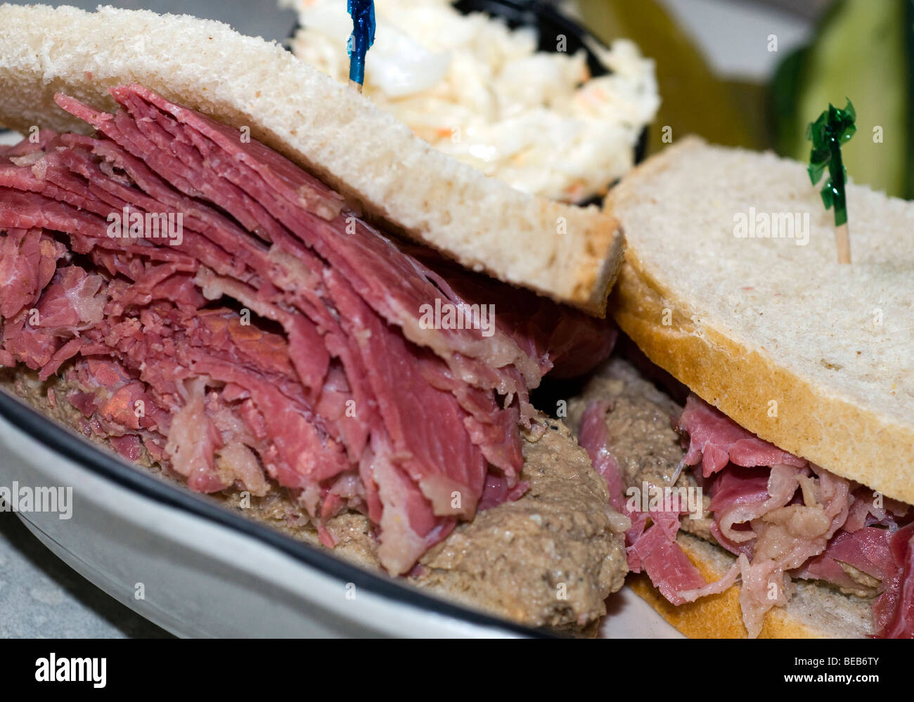 thick corned beef sandwich with chopped liver on rye bread in jewish