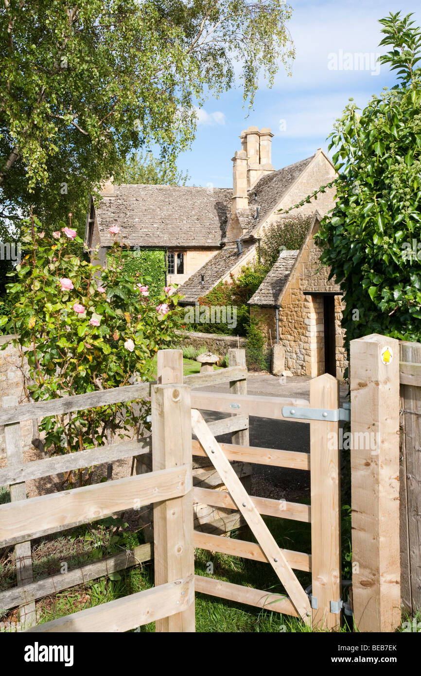 A stile on a public footpath leading into the Cotswold village of Saintbury, Gloucestershire Stock Photo