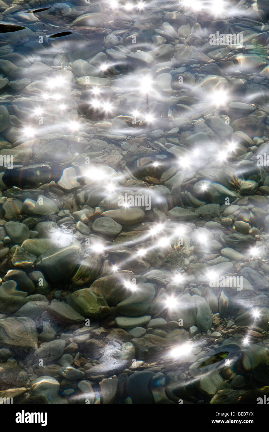 Sunlight reflecting on the water Stock Photo - Alamy
