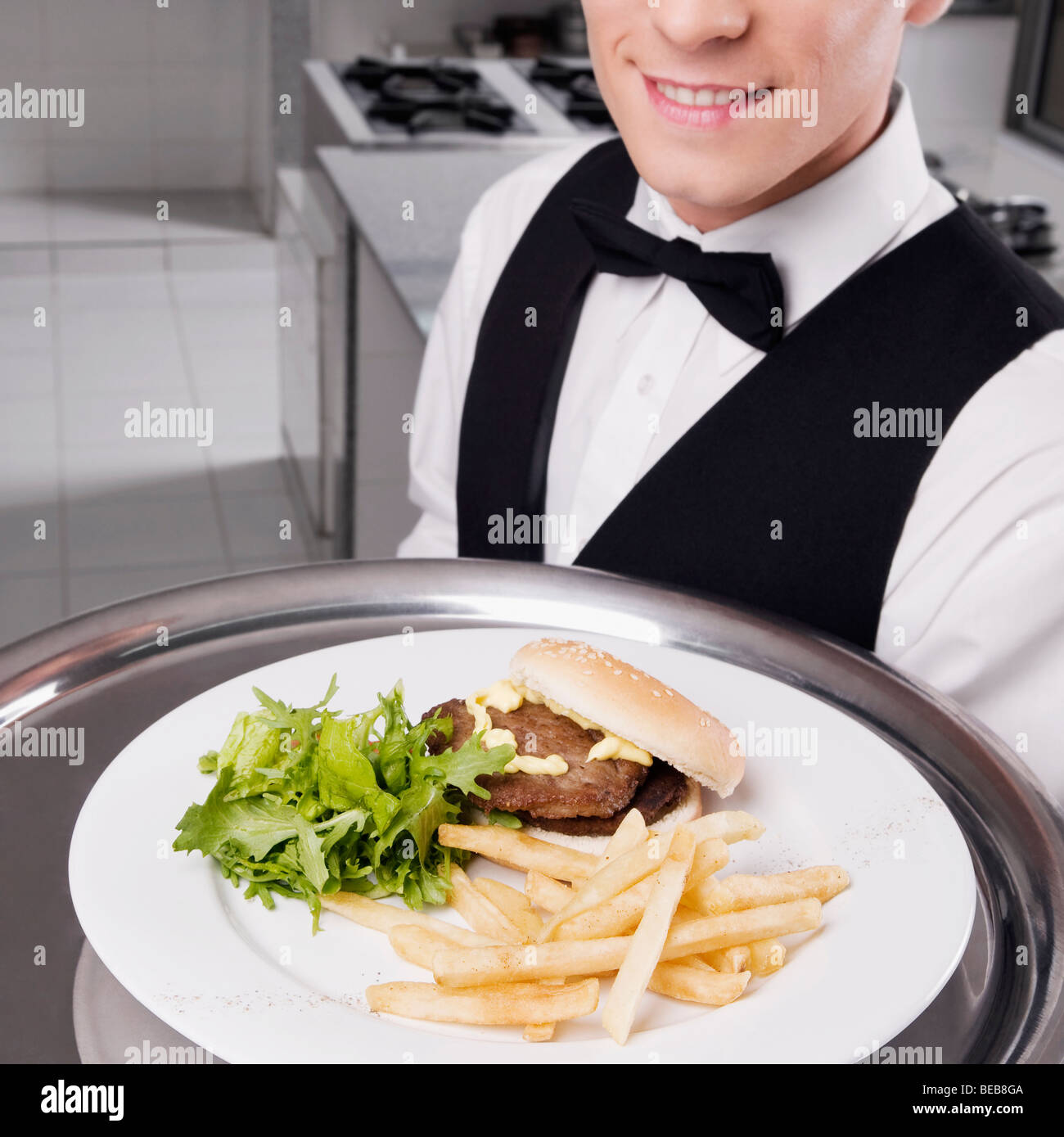Waiter holding fast food tray hi-res stock photography and images - Alamy