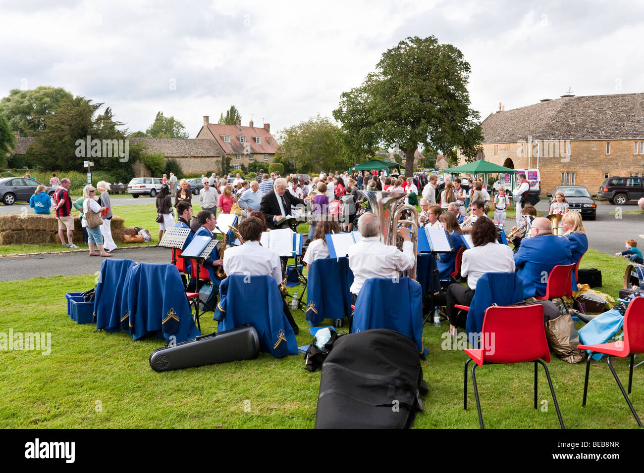 A brass band playing at a fete on the village green on August Bank Holiday in the Cotswold village of Willersey, Gloucestershire Stock Photo