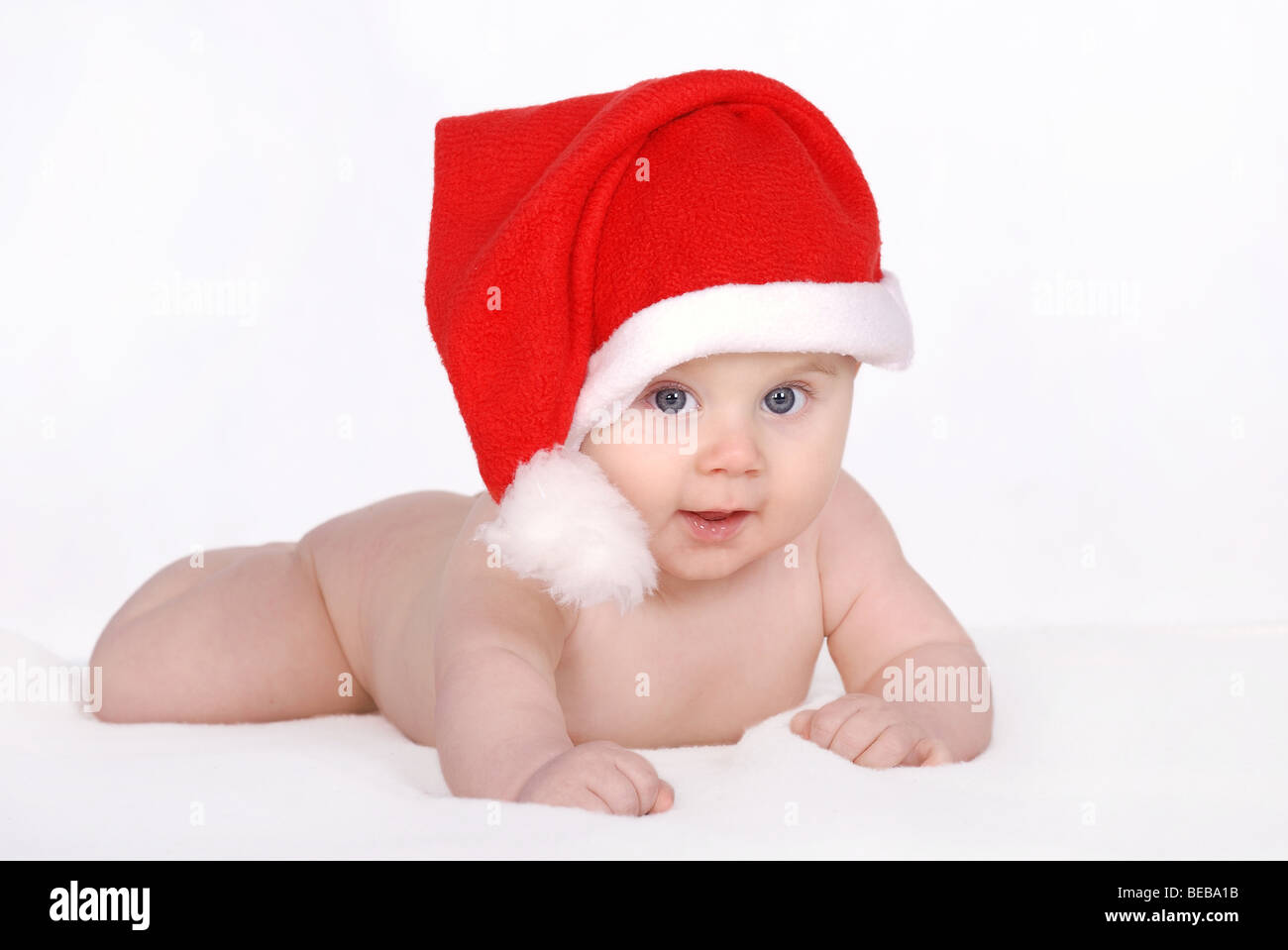 Christmas baby - Little baby portrait in red hat Stock Photo