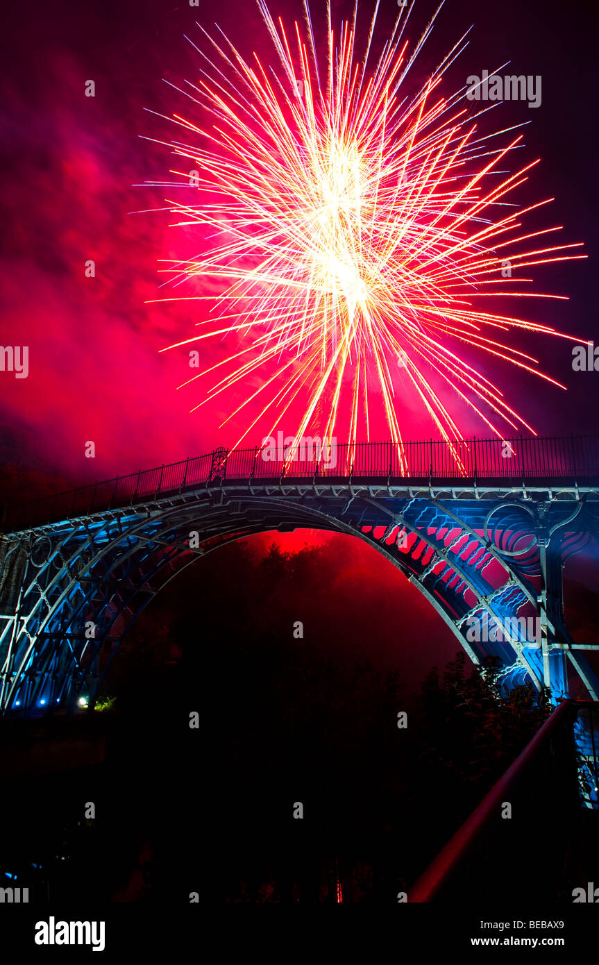 Firework display over the illuminated iron bridge at Ironbridge Shropshire during World Heritage
