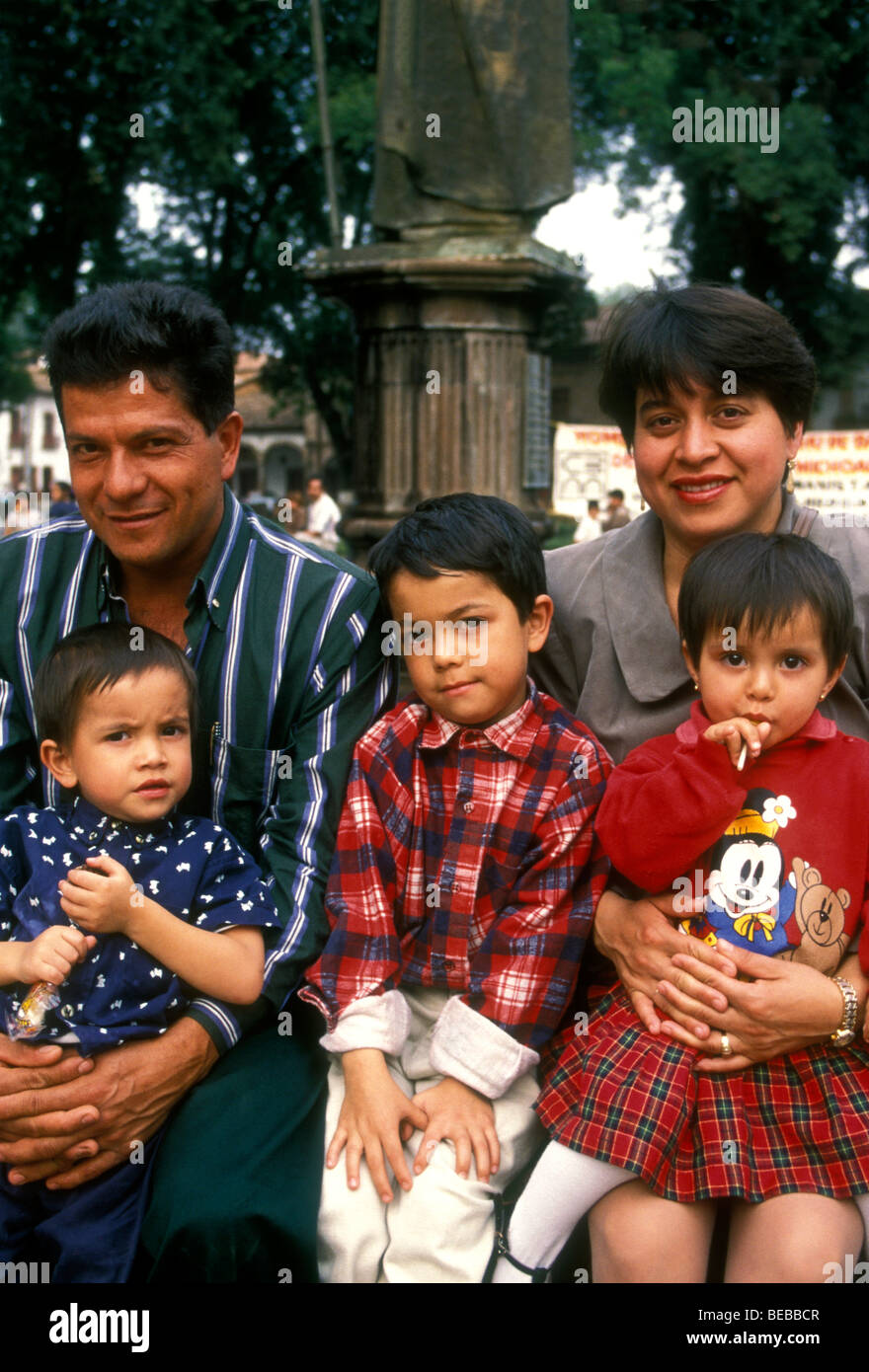 Mexicans, Mexican people, Mexican family, mother, father, children, tourists, Plaza Vasco de Quiroga, town of Patzcuaro, Michoacan State, Mexico Stock Photo
