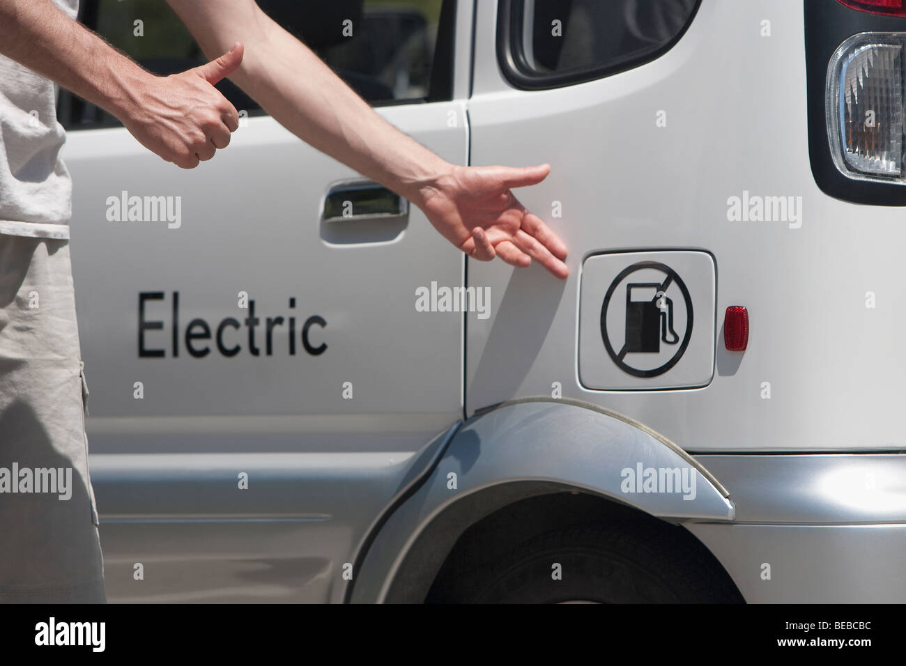 Man pointing at an electric car, Los Angeles, California, USA Stock Photo Alamy