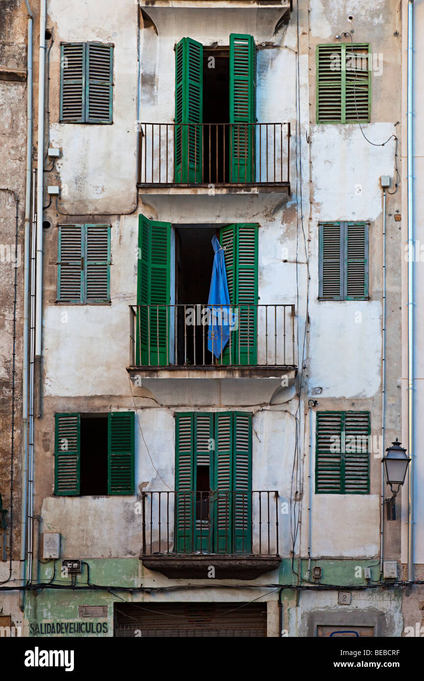 Balconies and shuttered windows in dirty back street Palma Mallorca Spain Stock Photo