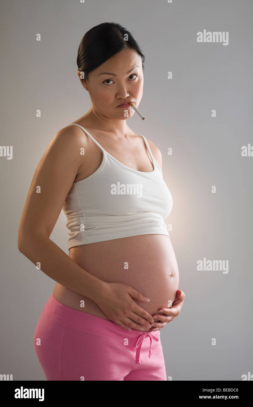 Cigarette in belly button hi-res stock photography and images