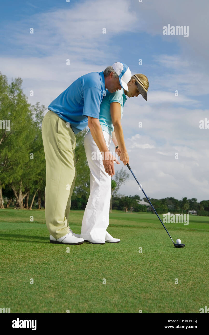 Golf instructor teaching golf to a woman, Biltmore Golf Course, Coral