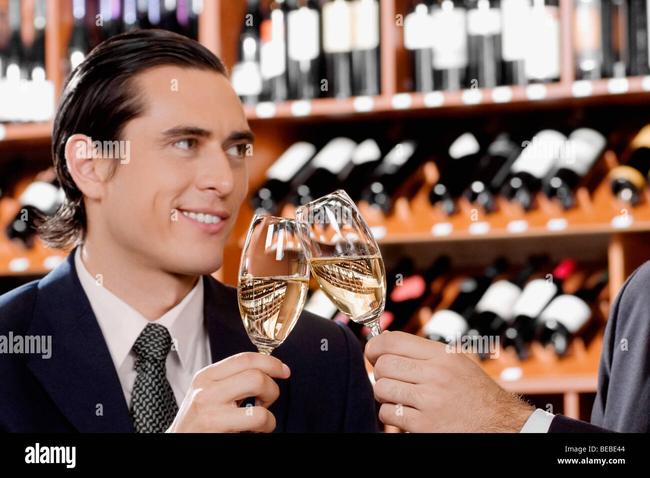 Businessmen toasting with wine Stock Photo Alamy