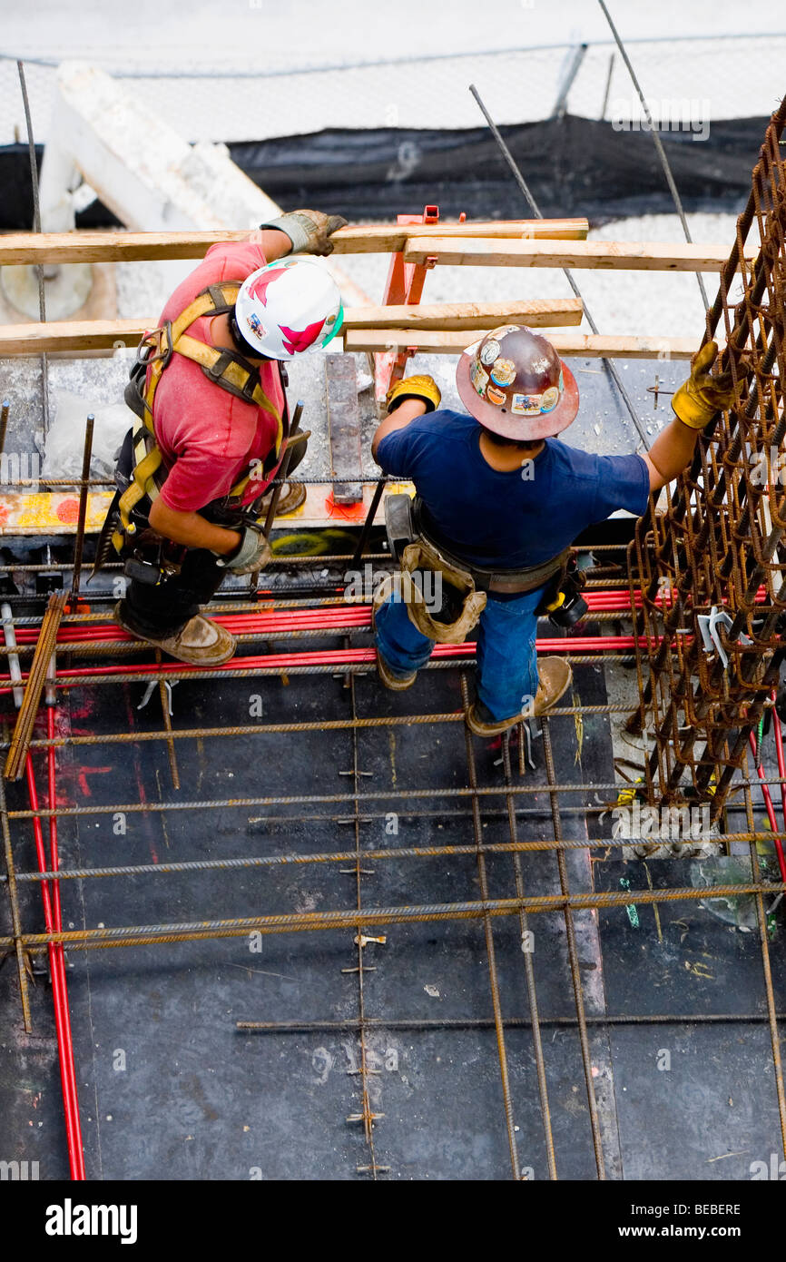 High angle view of two construction workers standing at a construction site Stock Photo