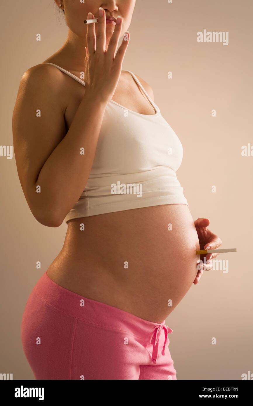 cigarette in belly button Cigarette in belly button hi-res stock photography and images