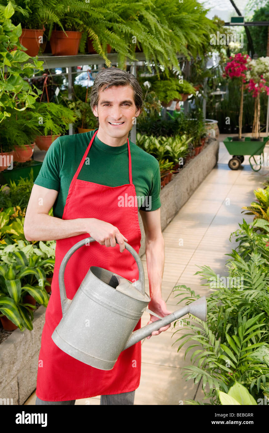 Man watering plants Stock Photo Alamy