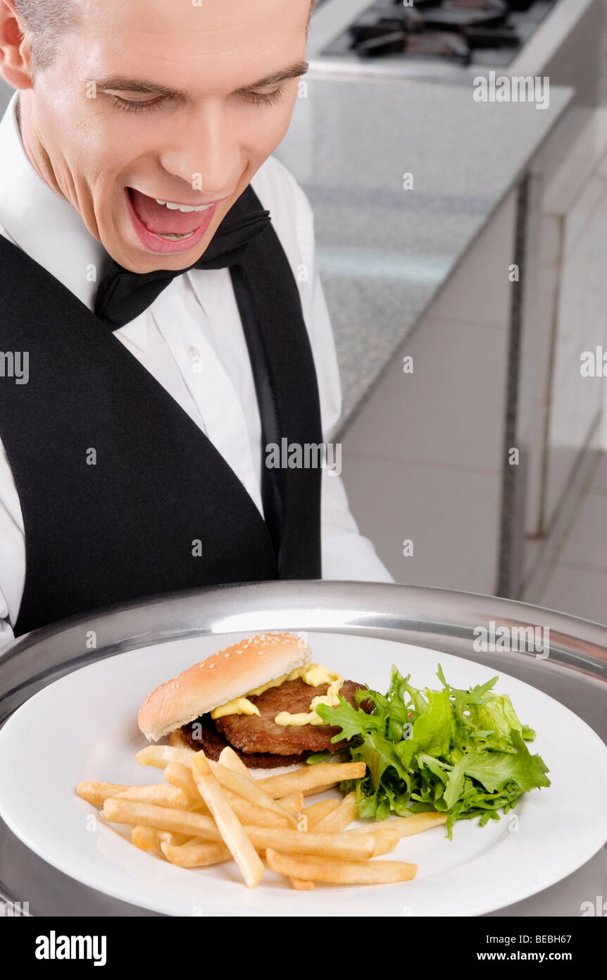 Waiter holding fast food tray hi-res stock photography and images - Alamy
