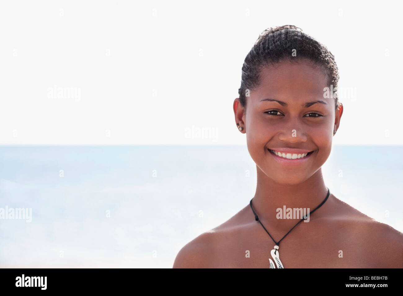 Portrait of a woman smiling on the beach Stock Photo - Alamy