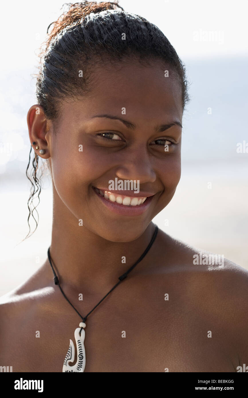 Portrait of a woman smiling on the beach Stock Photo - Alamy