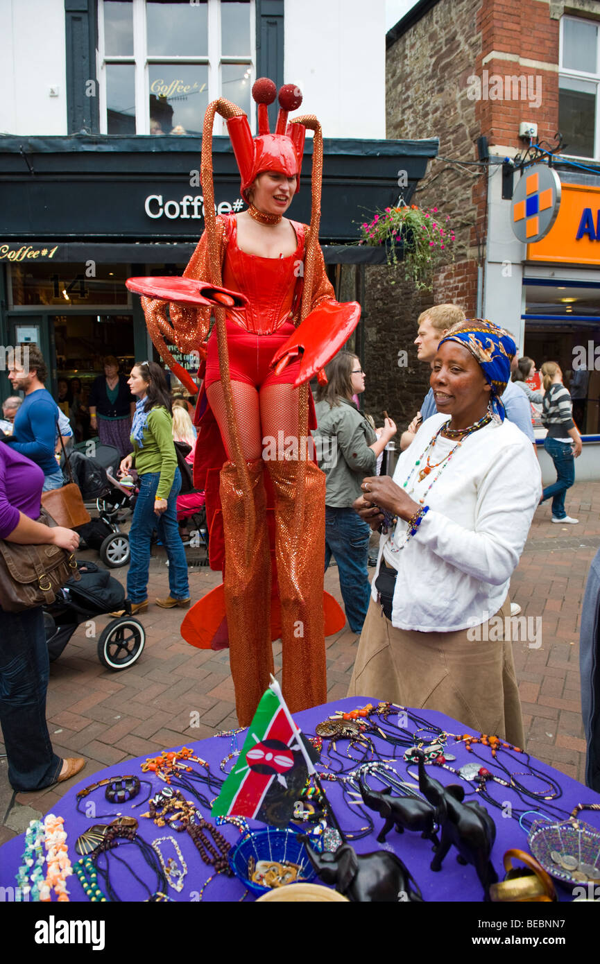 Stilt walking street performance artists dressed as lobsters at