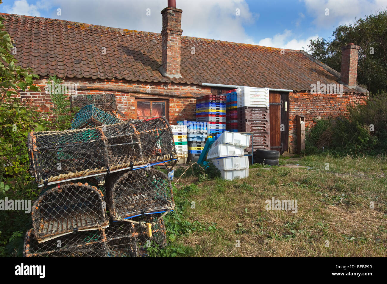crabpots and fishermans huts Brancaster Staithe Norfolk in late summer