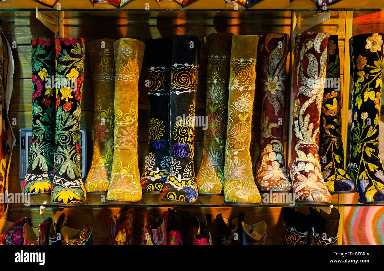 Modern fashionable versions of traditional suzani tapestry boots on sale in the Grand Bazaar in Istanbul Stock Photo