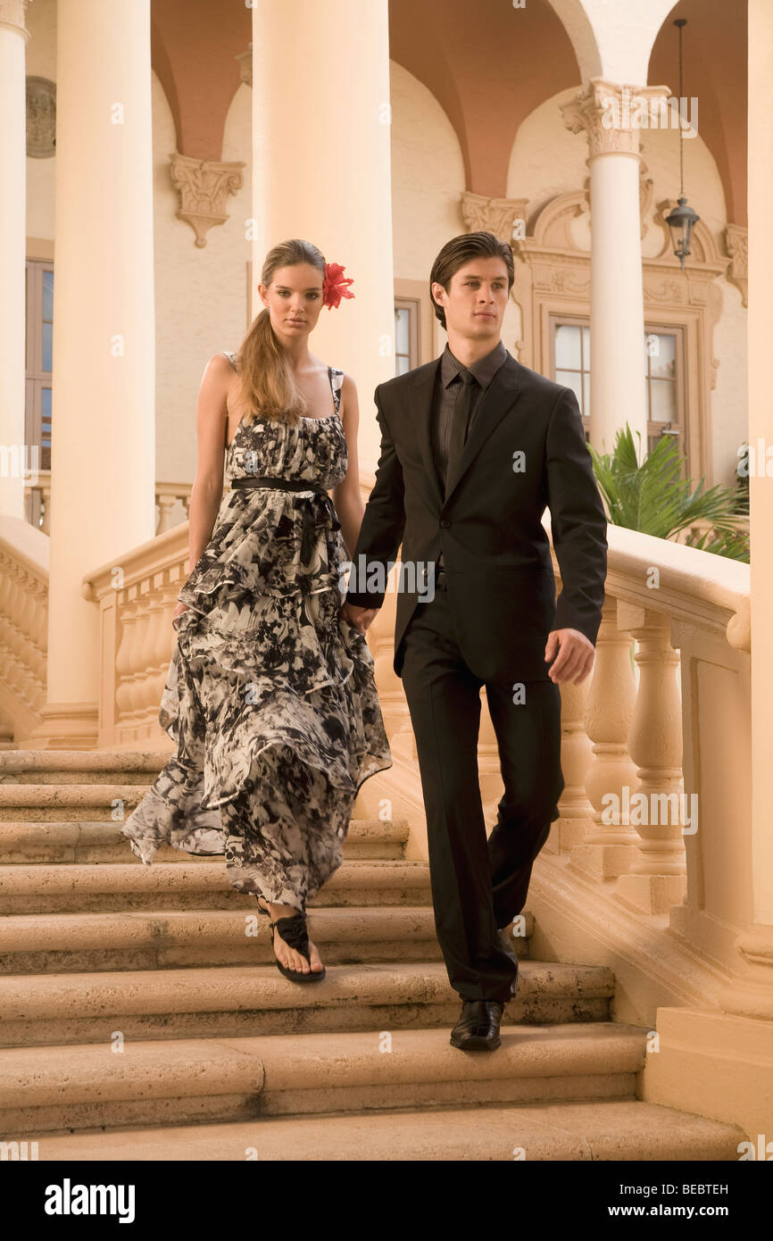 Couple moving down steps, Biltmore Hotel, Coral Gables, Florida, USA Stock Photo