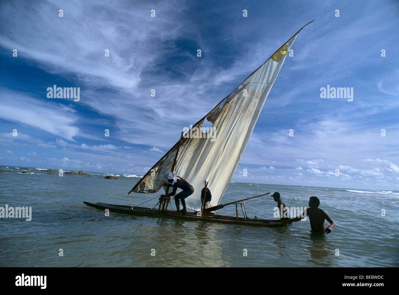 Pushing Raft Traditional fisherman pushing raft into ocean, Recife, Brazil ...
