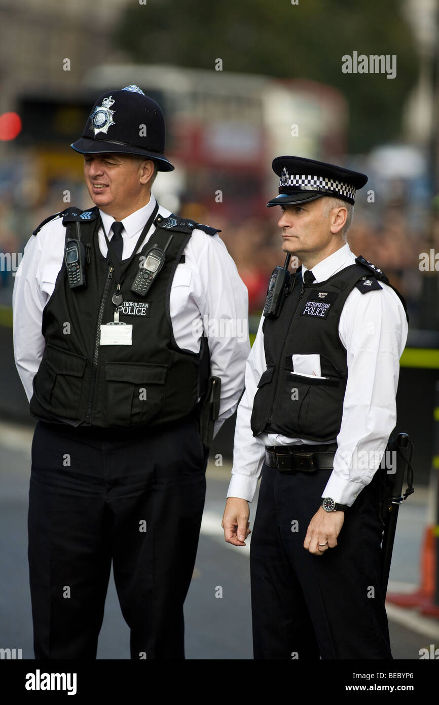 British policemen on duty outside the Houses of Parliament in London Stock Photo