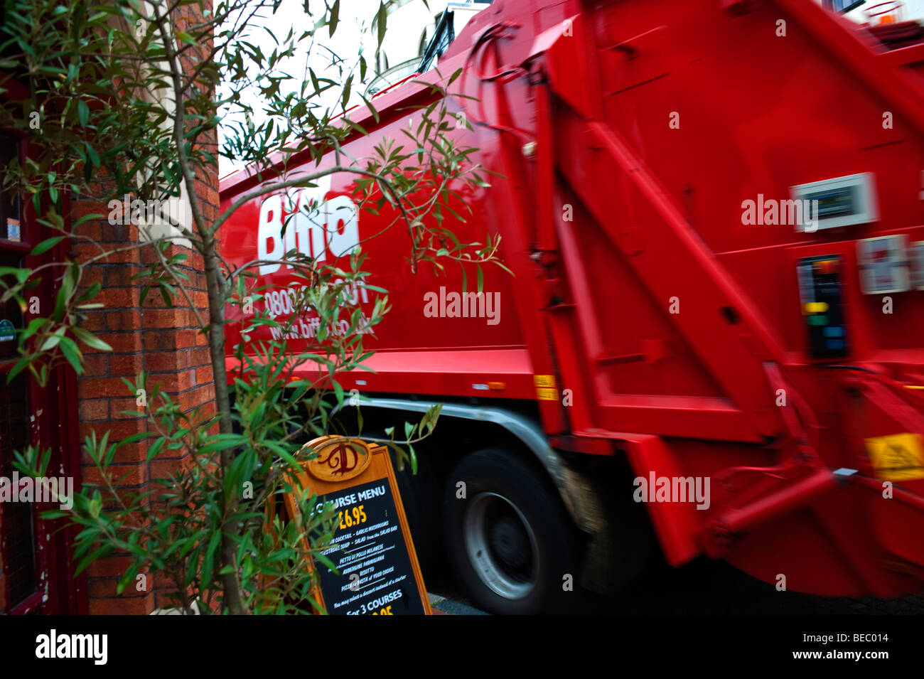 Red garbage collection lorry Stock Photo Alamy
