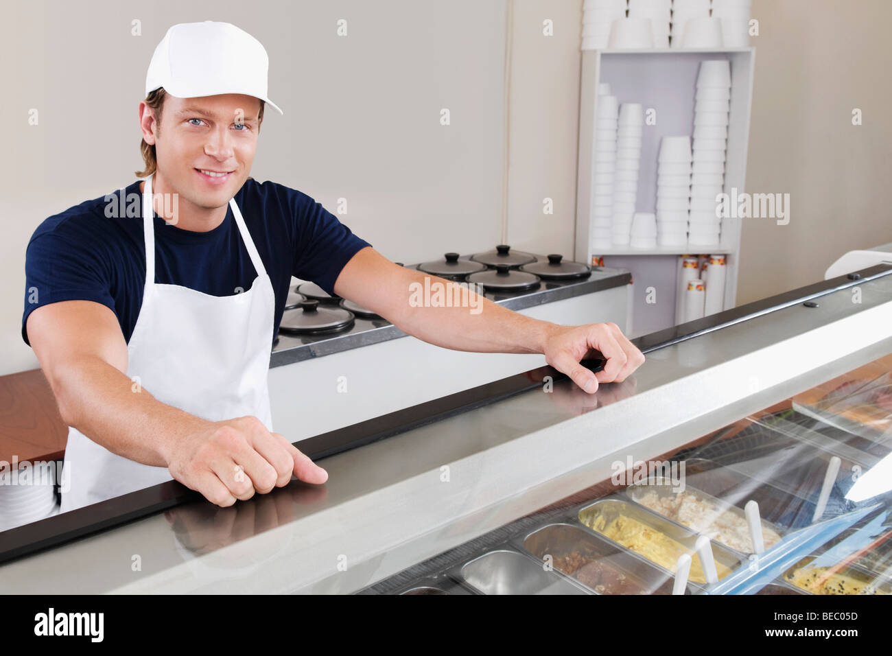 Sales clerk in an ice cream parlor Stock Photo Alamy