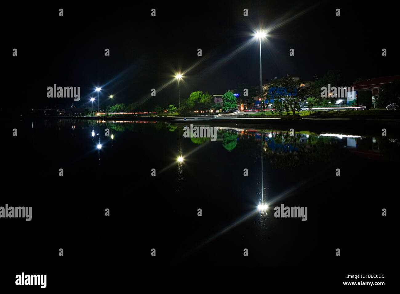 Streetlights and their reflection in a lake Stock Photo