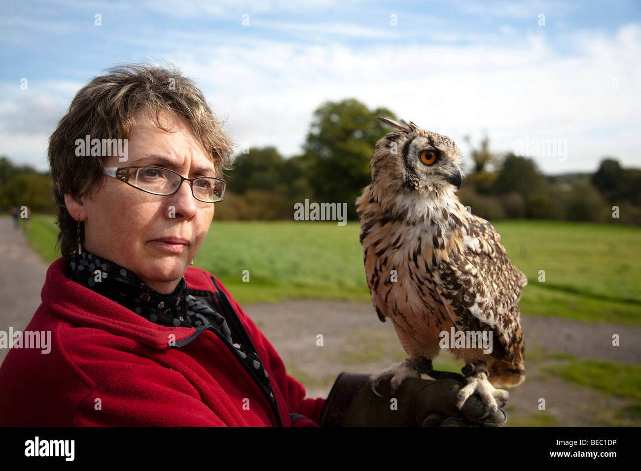 Woman handler with Bengal Eagle owl at Groombridge Place Gardens Stock Photo
