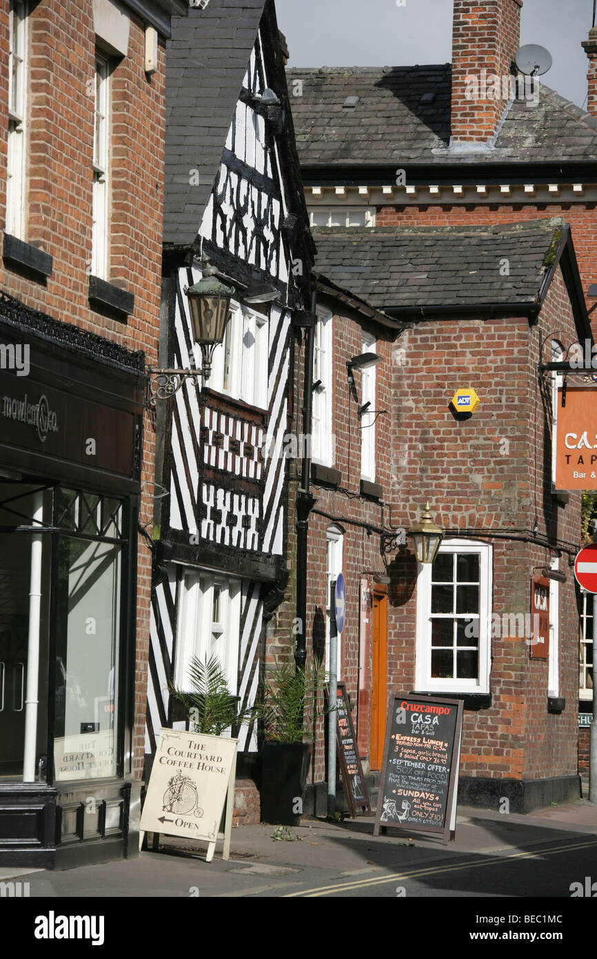 Town of Knutsford, England. Shops on Knutsford’s Town Centre including a black and white timber framed Tudor style building. Stock Photo