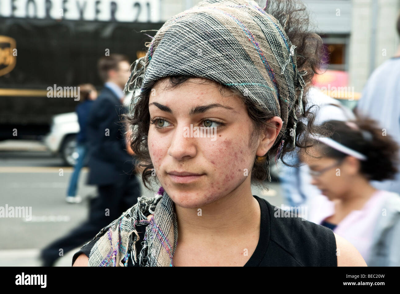 pretty young girl wearing headscarf with beautiful eyes & acne scars in Union Square 14th Street Manhattan New York City Stock Photo