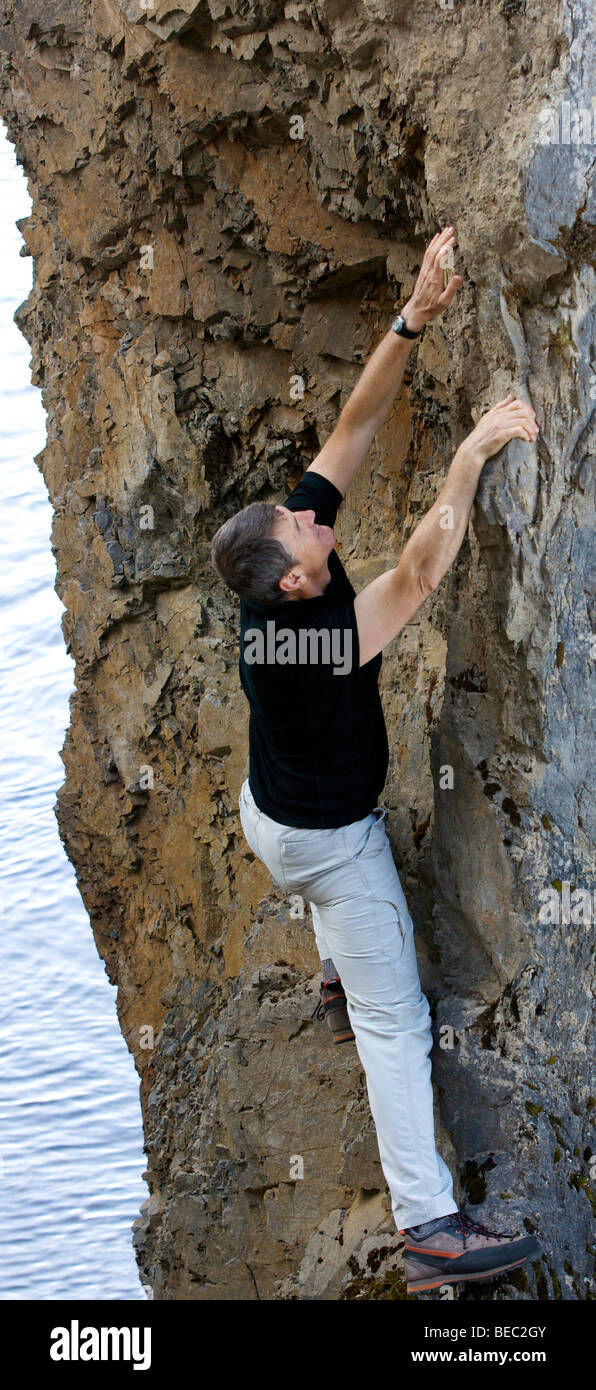 Man rock climbing with watch hi-res stock photography and images - Alamy
