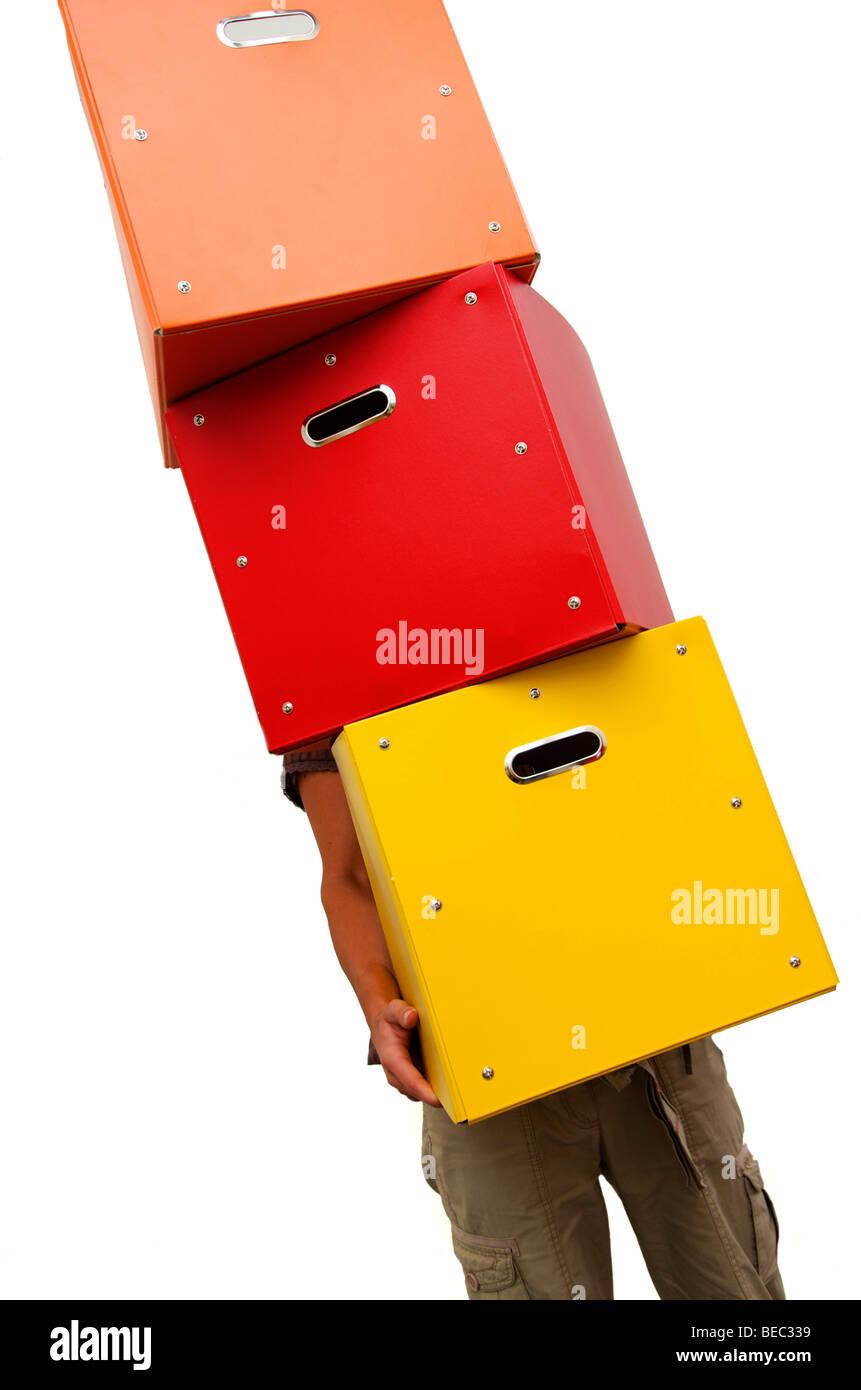 Woman / student carrying a stack of boxes Stock Photo