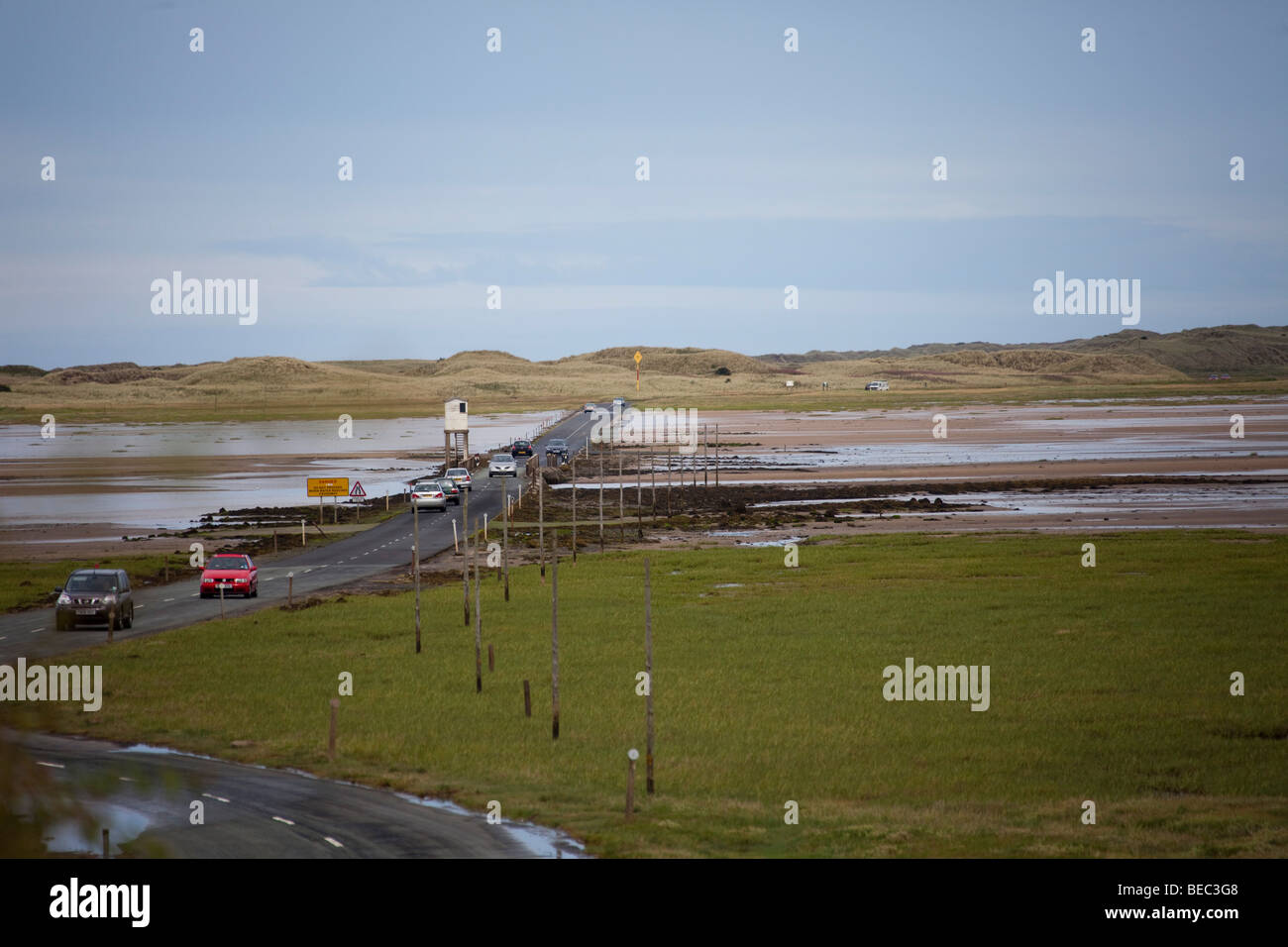Causeway tide road path at Lindisfarne Holy Island UK Northumberland.96945 Holy Island Causeway Stock Photo
