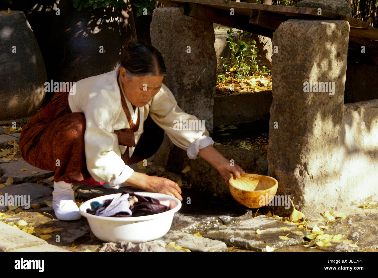 Woman washing clothes, Korean Folk Village, South Korea Stock Photo