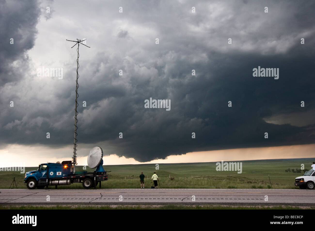 Storm chasers with Project Vortex 2 watch a distant wall cloud and supercell in Goshen County, Wyoming, June 5, 2009. Stock Photo