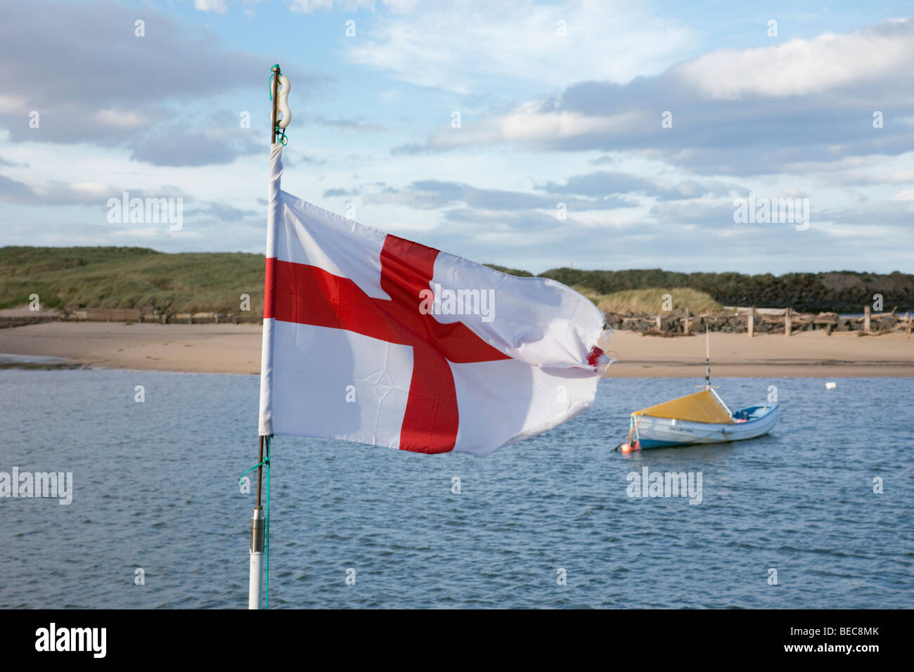 Amble, Northumberland, England, UK, Britain. England flag flying by the River Croquet estuary Stock Photo