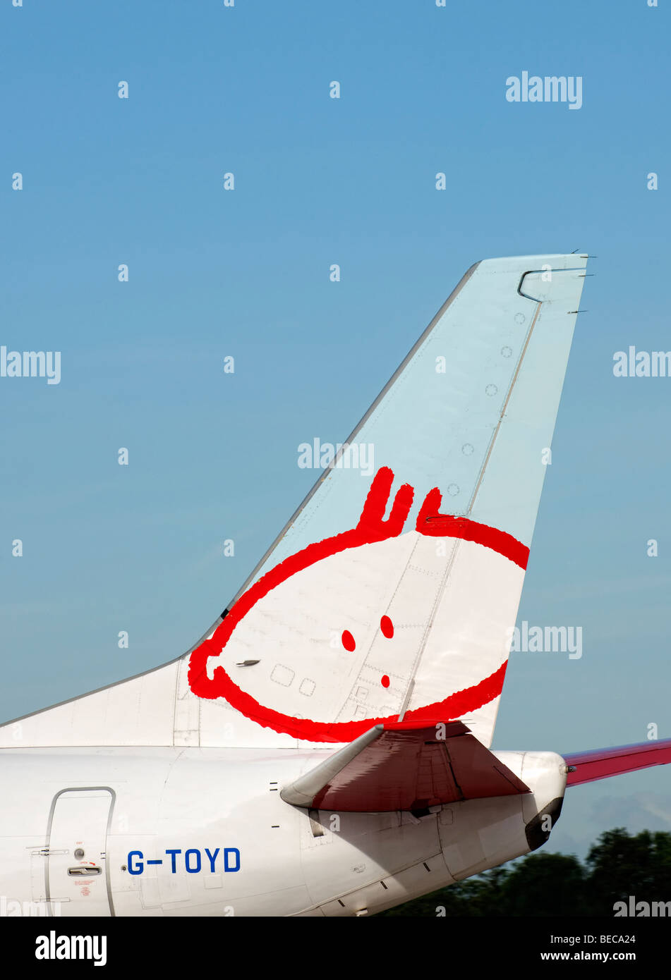 Tail fin of a BMI Baby aircraft as it taxis for take off from Manchester Airport (Ringway Airport) in Manchester, England Stock Photo