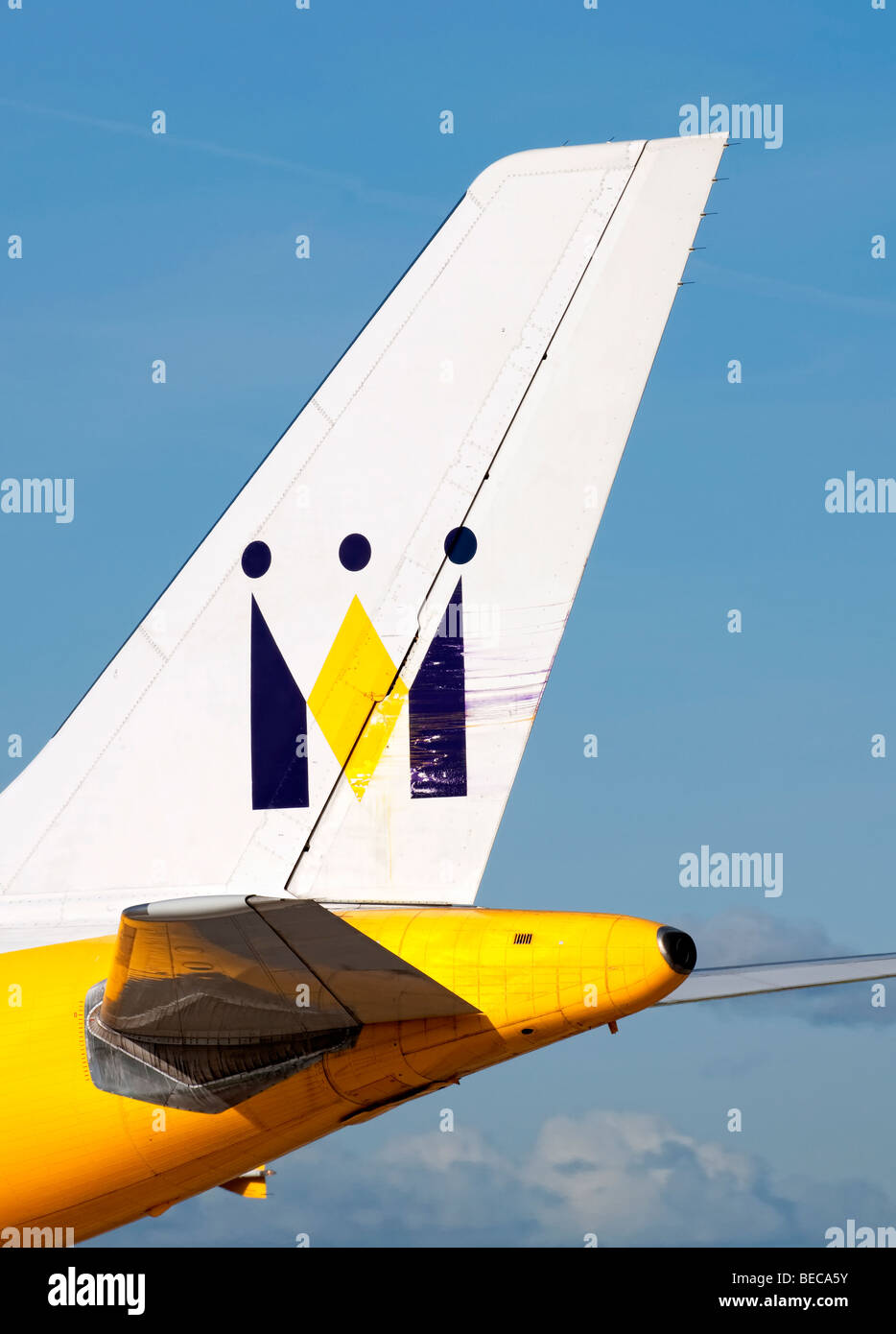Tail fin of a Monarch aircraft as it taxis for take off from Manchester Airport (Ringway Airport) in Manchester, England Stock Photo