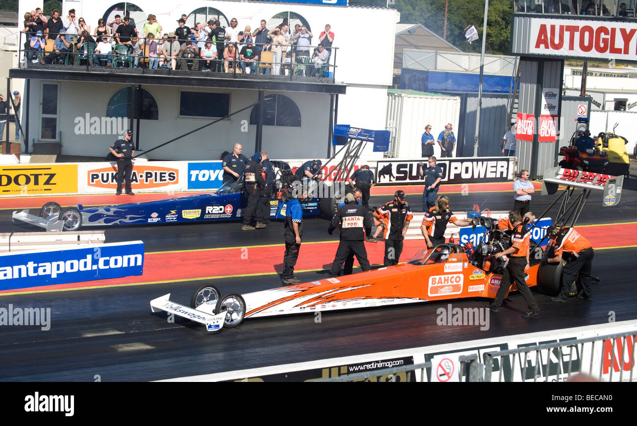 Dragsters getting prepared to race at the FIA European Drag Racing Championship finals at Santa Pod, England. Stock Photo