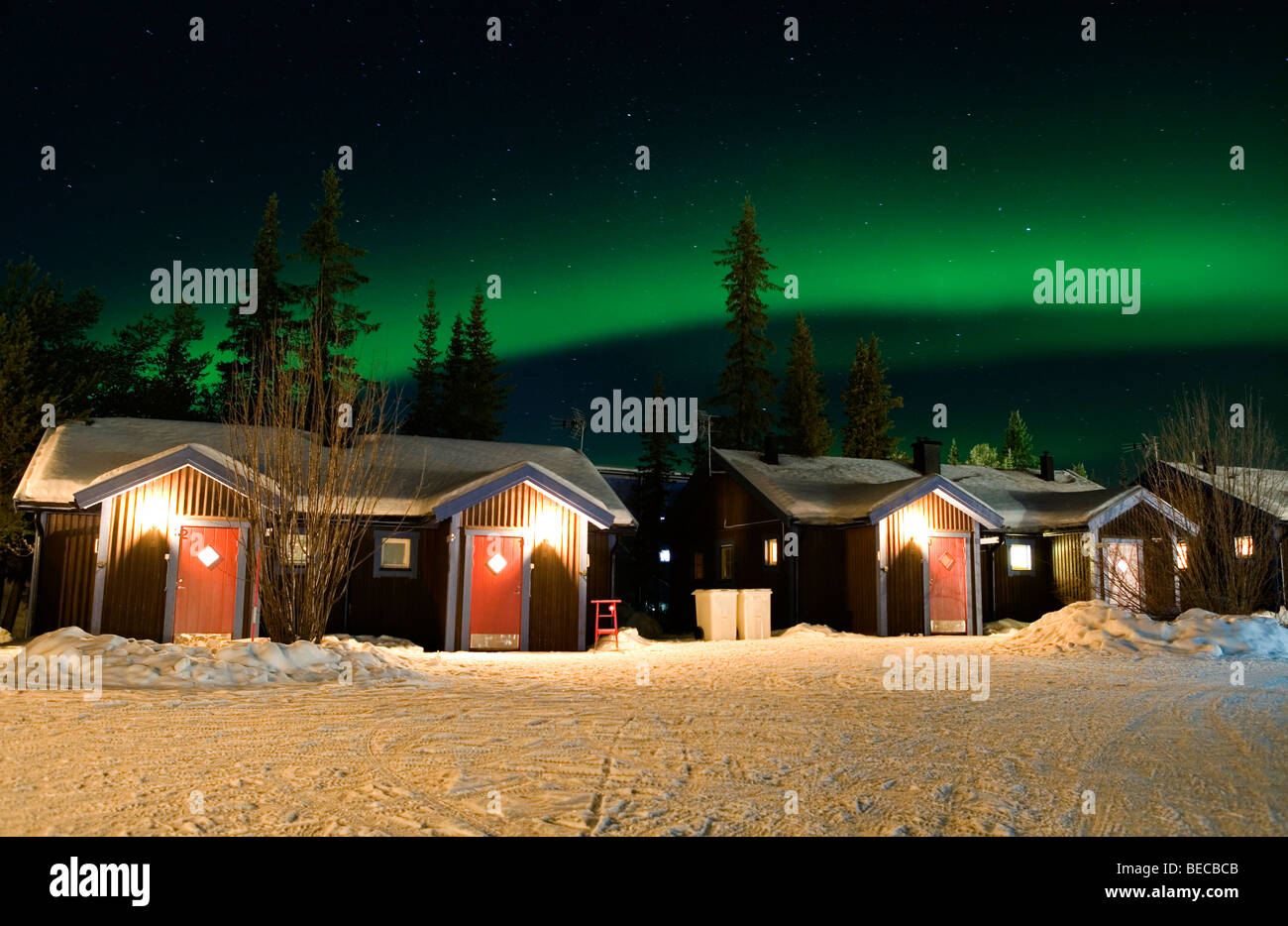 Northern lights over cabins at the Ice hotel in Jukkasjärvi, Sweden. Stock Photo