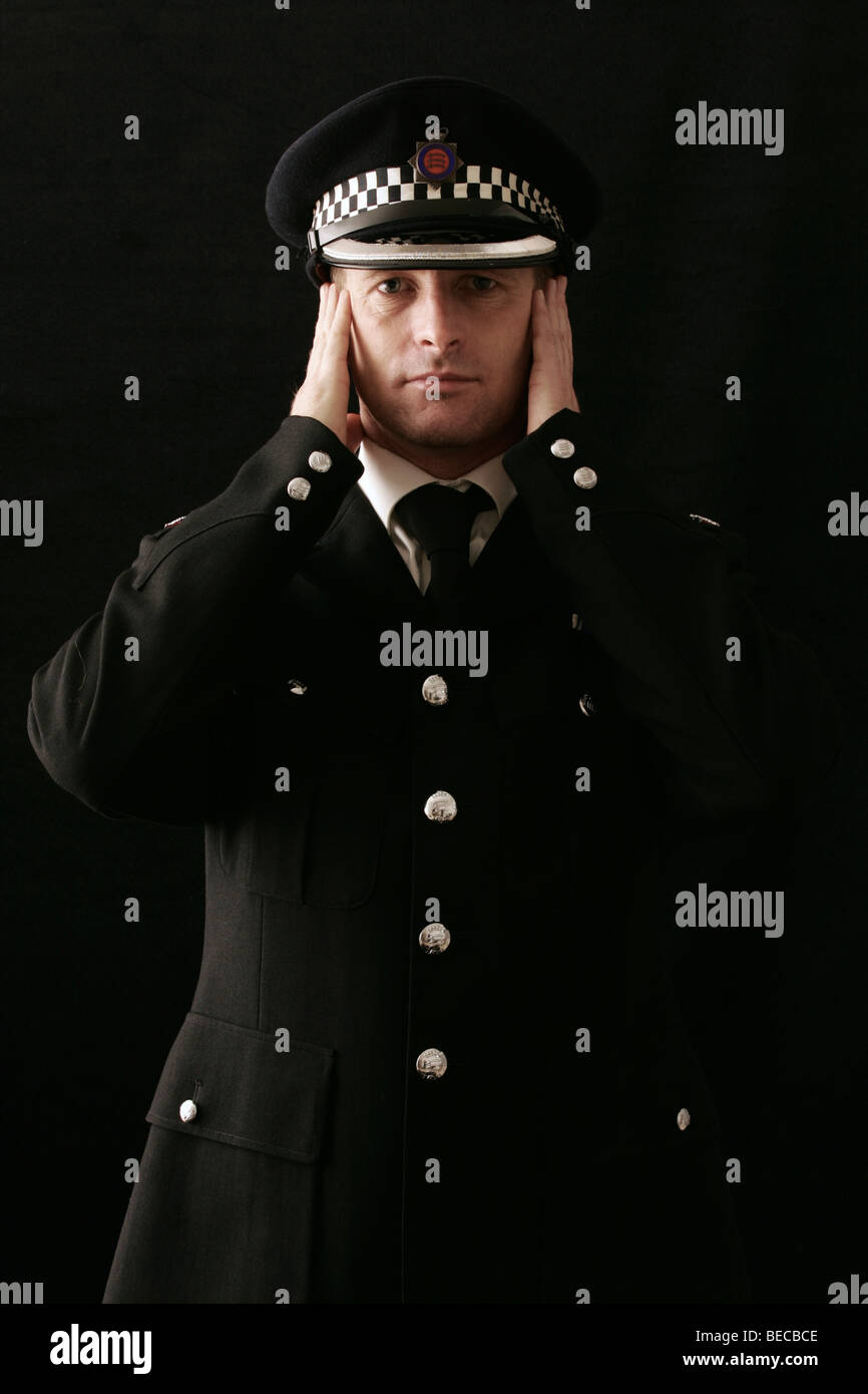 British Policeman on plain background Stock Photo