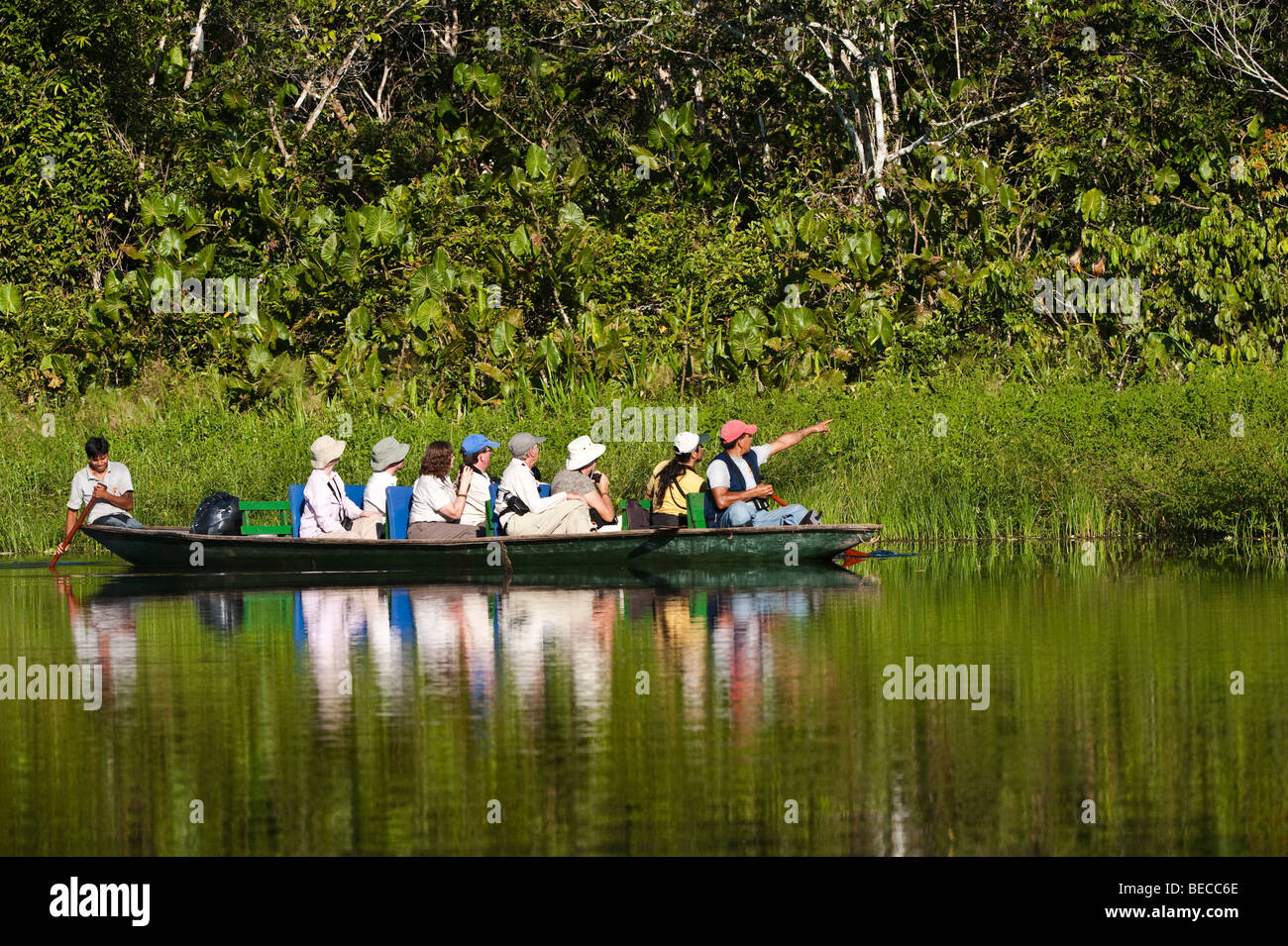 Tourists in boat with the local guide Napo Wildlife Centre Anangucocha Lake Amazonian Rainforest Ecuador South America Stock Photo